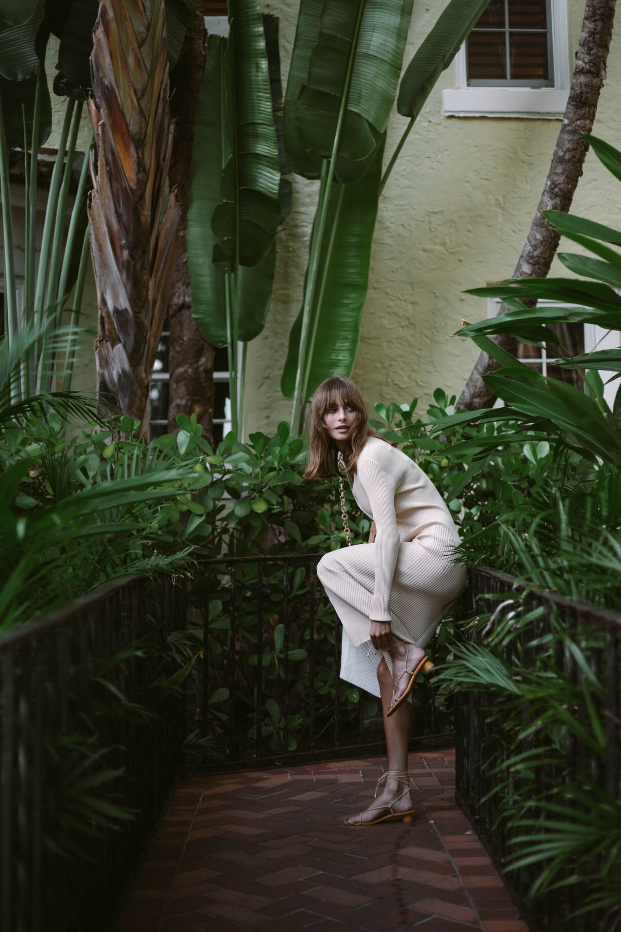 A girl standing near the tress at Brazilian Court