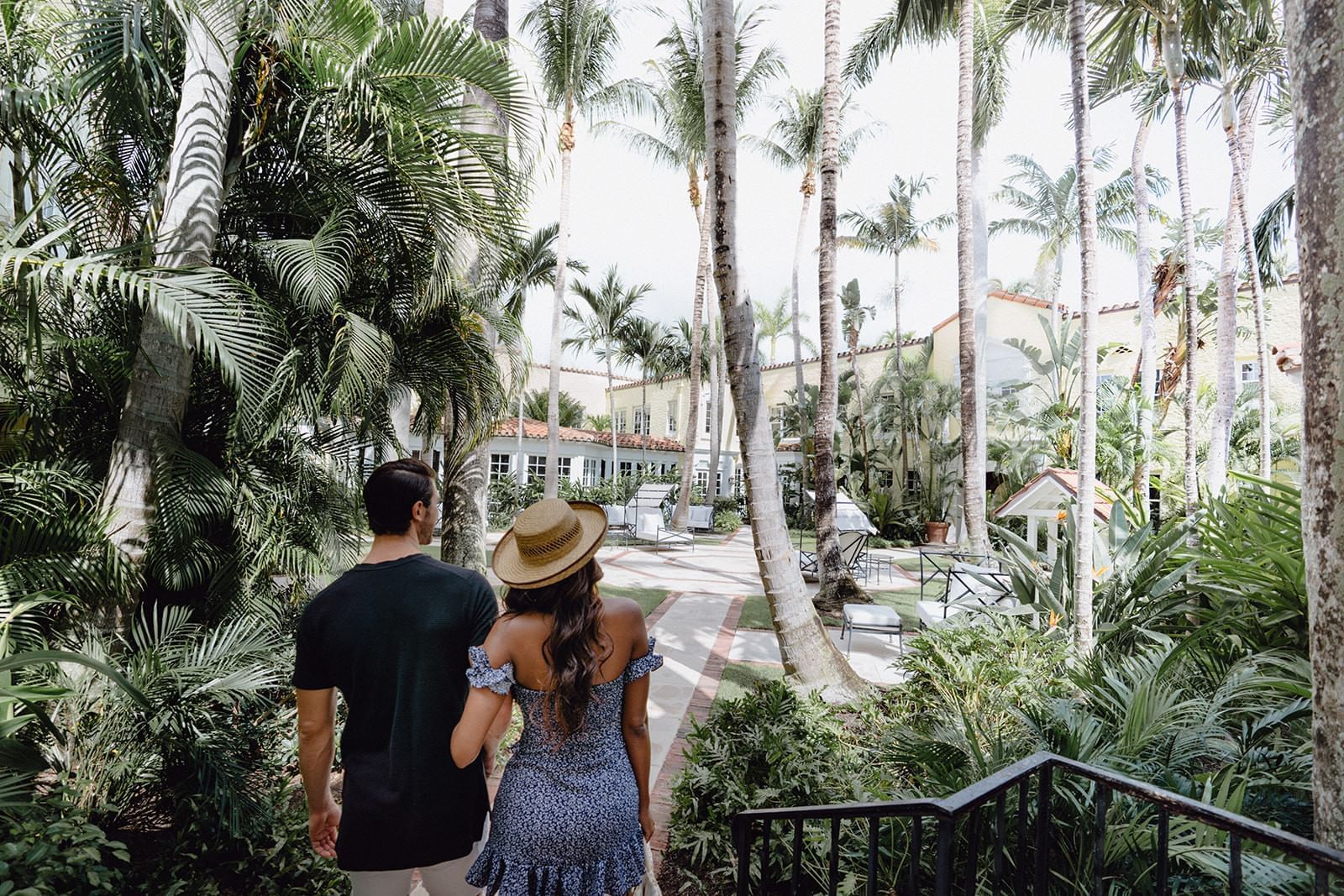 A couple walking into the private courtyard at Brazilian Court